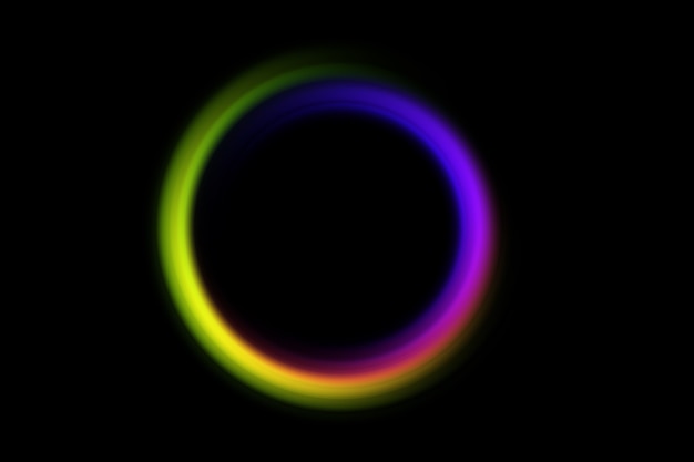 Abstract blurred circle in rainbow colors on a black.