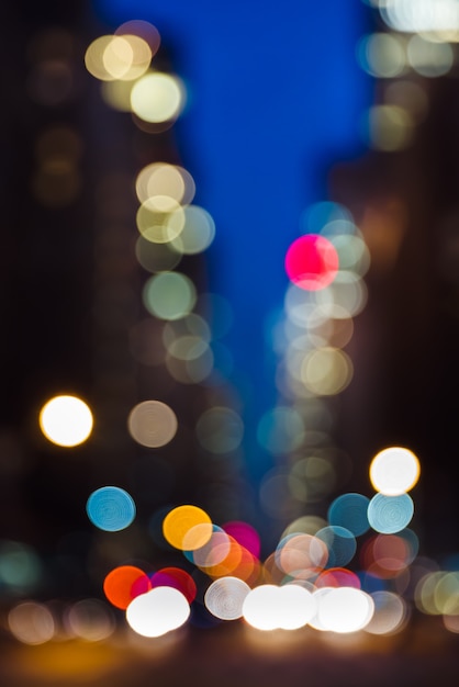 Abstract blurred city background. Large city street lights at night. Lights and shadows of New York City