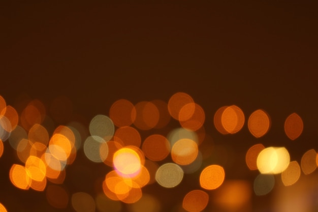 Abstract Blurred Gold and Orange Illuminated City Lights for Background or Wallpaper