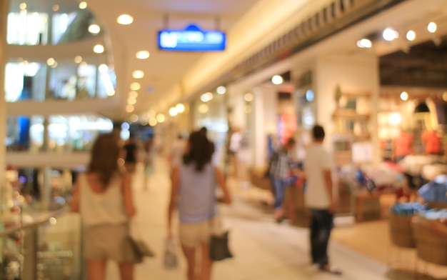 Abstract blurred people enjoy shopping inside a department store