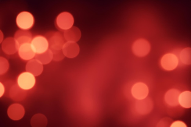 Abstract blurred red bokeh background with soft light spots