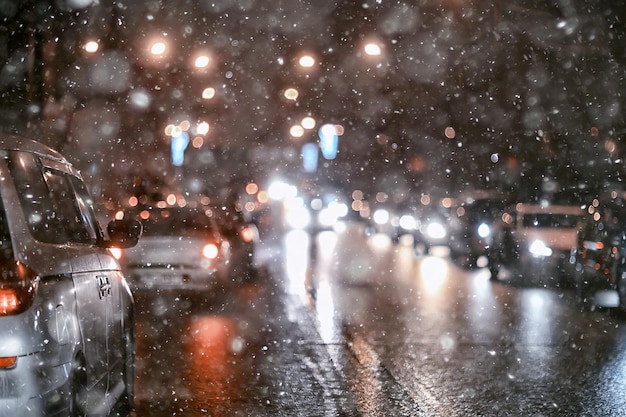 abstract blurred view of the night city from a car window, traffic in the city