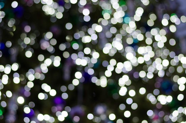 Abstract bokeh of festoon lights on dark background. 