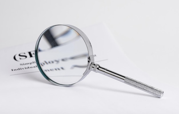 Abstract business research with finance documents and magnifying glass