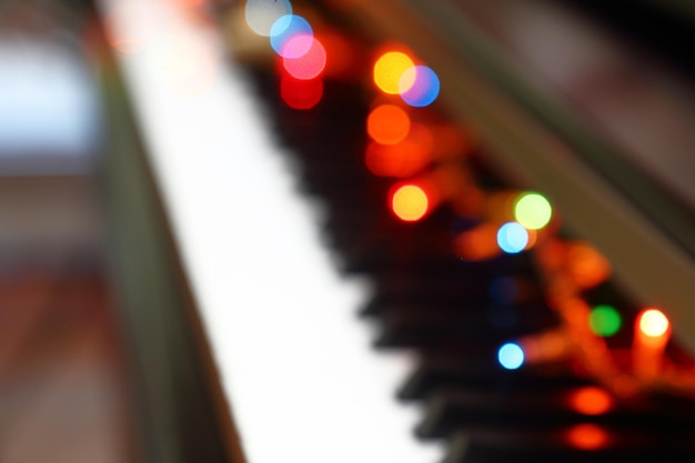 Abstract Christmas musical background with piano and lights