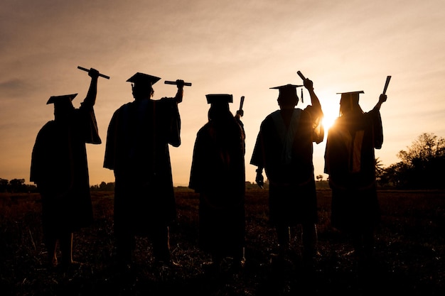 Abstract Close up Rear view group of the university graduates at Silhouette sunset