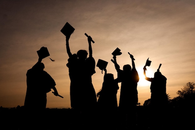 Abstract Close up Rear view group of the university graduates at Silhouette sunset