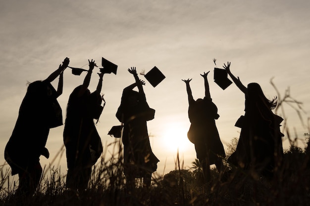 Abstract Close up Rear view group of the university graduates at Silhouette sunset