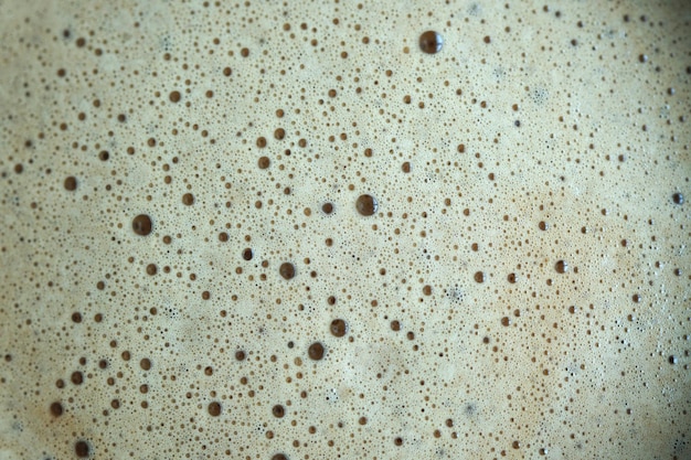 Abstract closeup photography of bubbles hot latte coffee background and textures