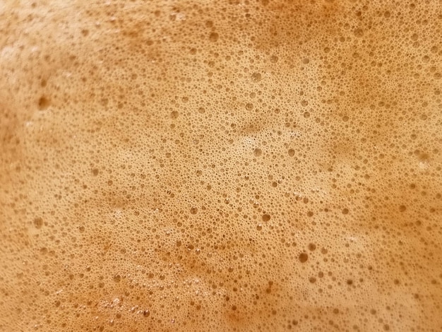 Abstract closeup photography of bubbles hot latte coffee background and textures