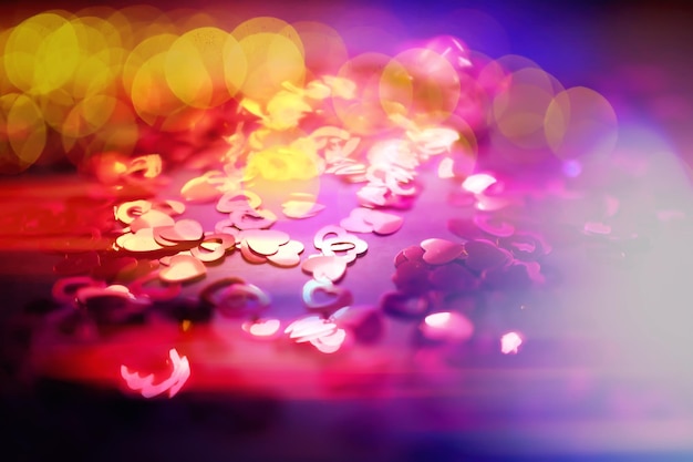 Abstract colored background Red toy in the shape of a heart on a glitter and bokeh background