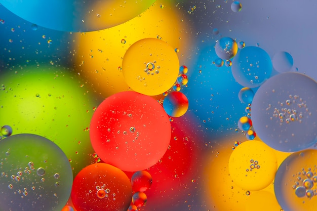 Photo abstract colored balls of oily liquid on a blurred surface