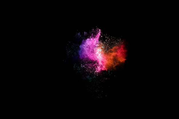 abstract colored dust explosion on a black background. 