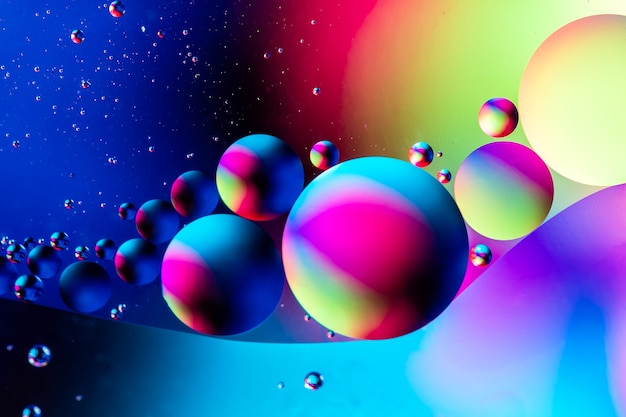 Abstract colorful background with oil on water surface. Oil drops in water abstract psychedelic. Space and universe planets styled psychedelic abstract image.