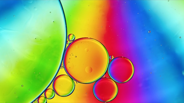 Abstract Colorful Food Oil Drops Bubbles and spheres Flowing on Water Surface Macro Photography