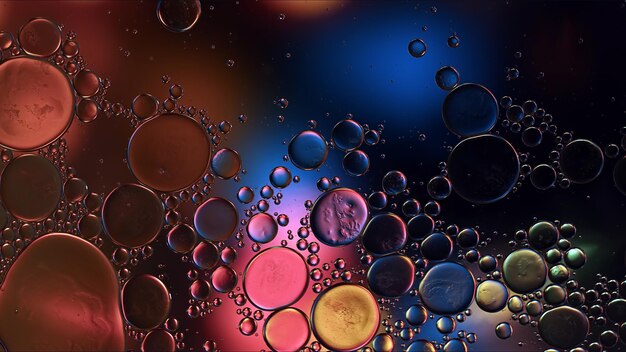 Abstract Colorful Food Oil Drops Bubbles and spheres Flowing on Water Surface Macro Photography