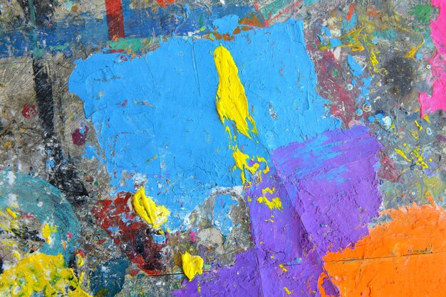 Abstract colorful painting for texture background. Splash acrylic color on wood table.