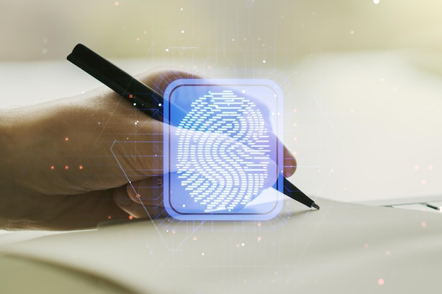 Abstract creative fingerprint concept with man hand writing in notebook on background Multiexposure