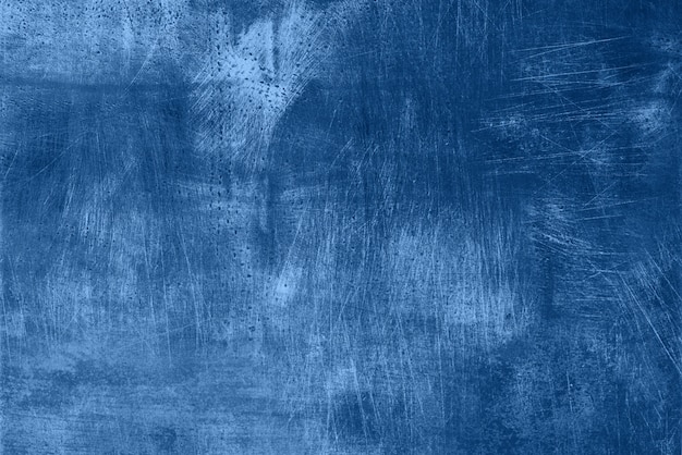 Abstract dark monochrome grunge texture with scratches, copy space. Trendy blue and calm color. Concrete texture, stone background