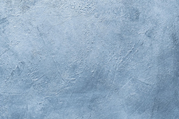 Abstract distressed decor background textured blue scratched plaster design free space concept