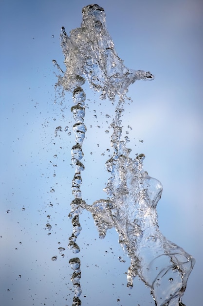 Abstract figure of a water fountain on blurred background