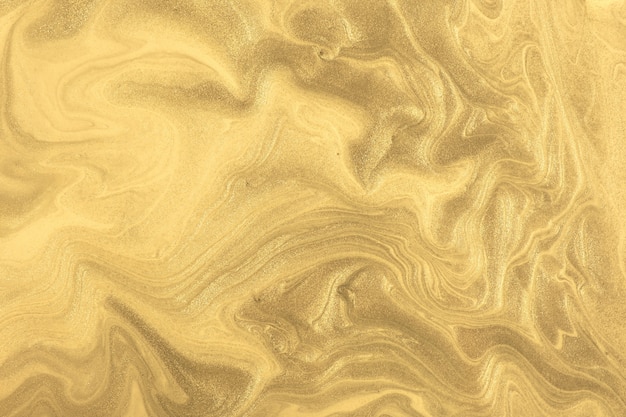 Abstract fluid art background dark golden colors. Liquid marble