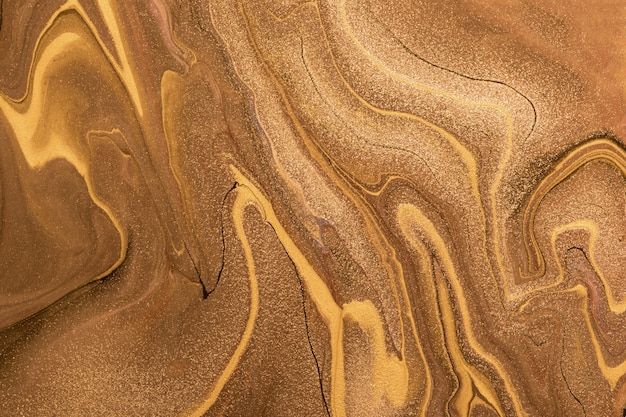 Abstract fluid art background dark golden and copper colors. Liquid marble