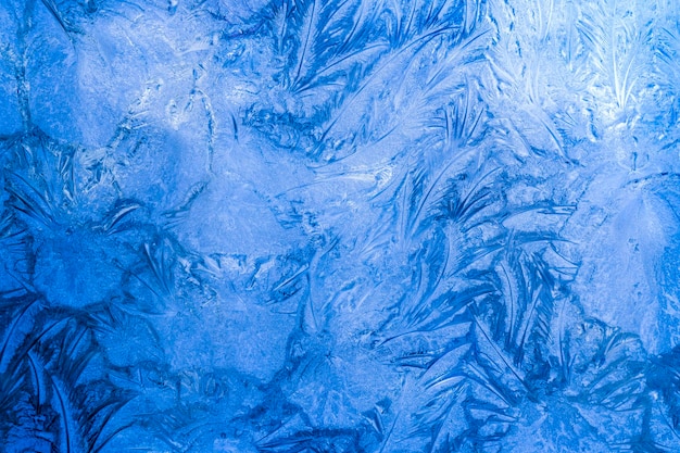 Abstract frosty pattern on glass background texture on the window