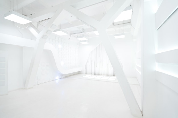 Abstract futuristic empty room interior in white with illumination in the style of a spaceship. geometric decoration on the walls.