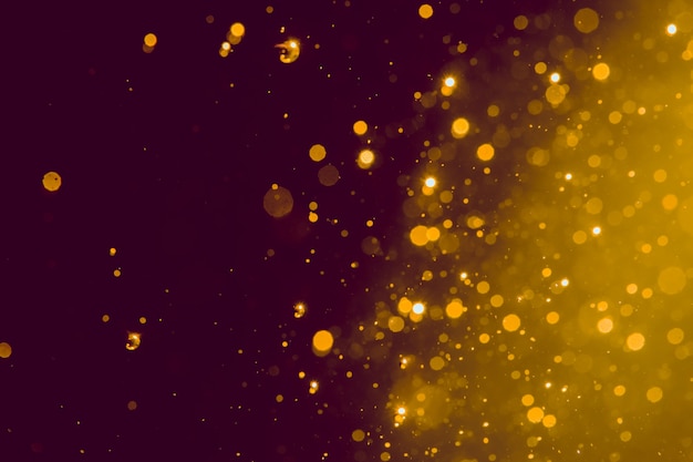 Abstract gold blur glitter bokeh on black 