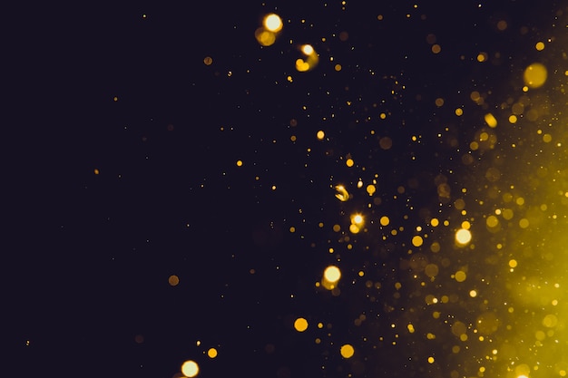 Abstract gold bokeh on black background