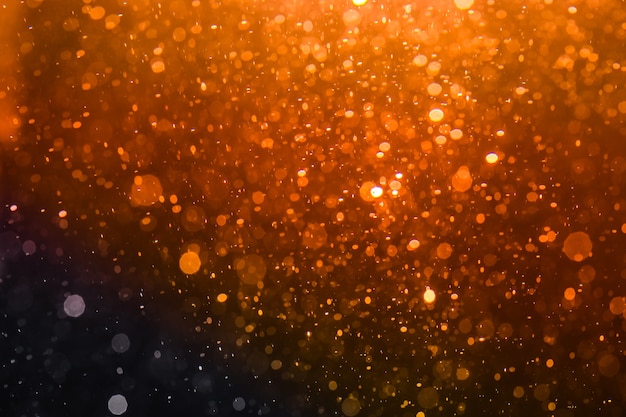 Abstract gold bokeh with black background