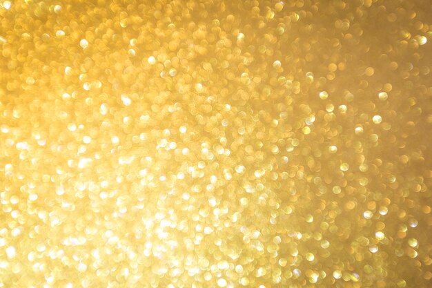 Abstract Gold glitter festive Christmas texture background blur with bokeh light