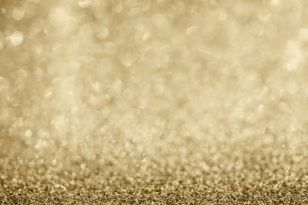 Abstract gold glitter sparkle blurred with bokeh background