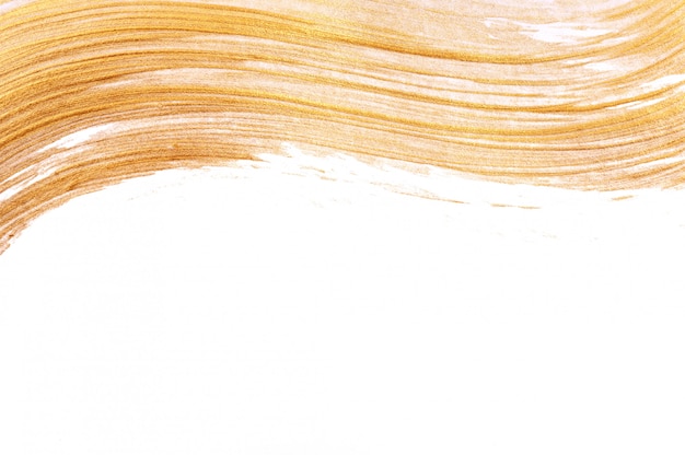 Abstract golden wavy brush stroke on white