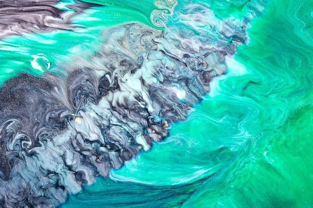 Abstract green black color background Multicolored fluid art Waves splashes and blots acrylic alcohol ink paints under water