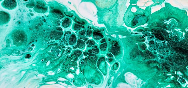 Abstract green color background Multicolored fluid art Waves splashes and blots acrylic alcohol ink paints under water