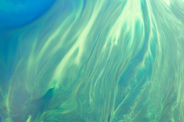 Abstract green color background Multicolored fluid art Waves splashes and blots acrylic alcohol ink paints under water