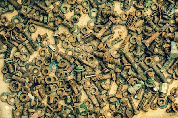 Abstract grunge metallic background from bolts screws nuts