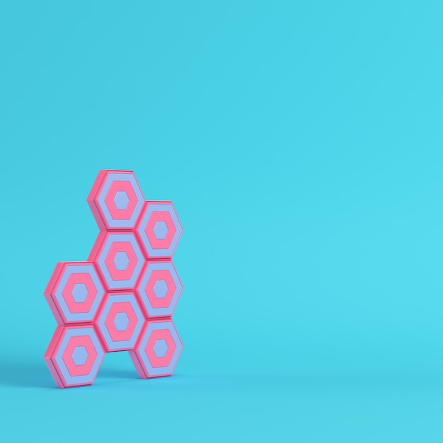 Abstract hexagons on bright blue background in pastel colors