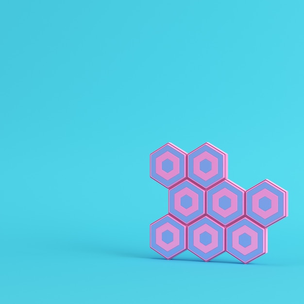 Abstract hexagons on bright blue background in pastel colors