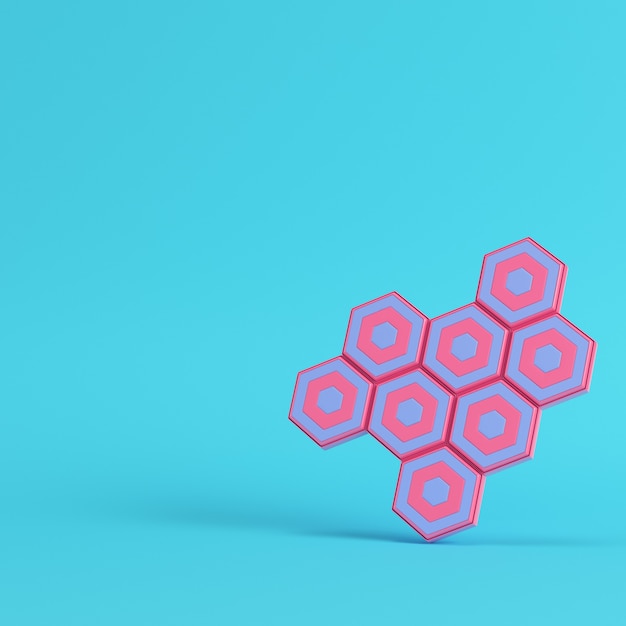 Abstract hexagons on bright blue background in pastel colors