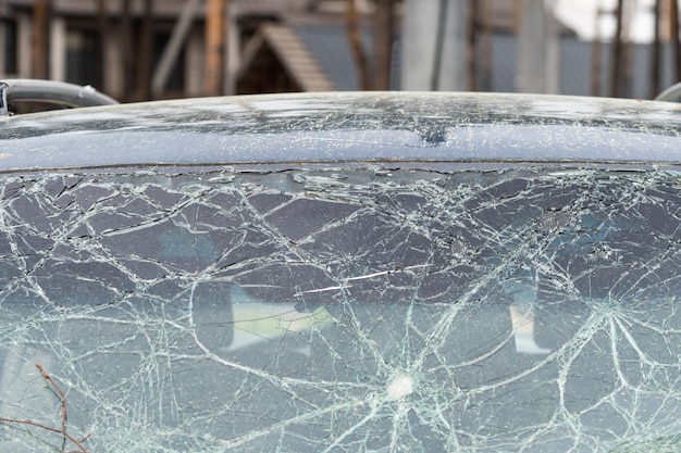 Abstract image of broken glass texture background Closeup of a broken car windshield Broken and damaged car