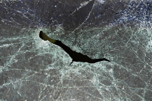 Abstract image of broken glass texture background Closeup of a broken car windshield Broken and damaged car