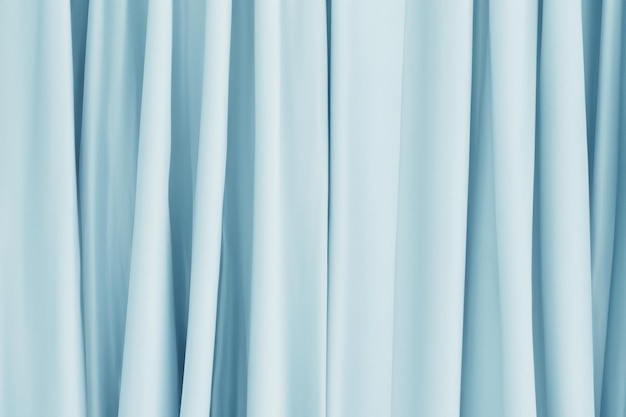 Abstract light blue fabric with smooth folds creating a minimalist and elegant texture