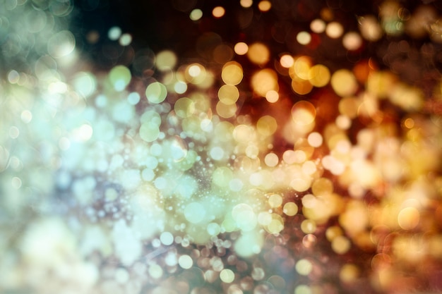 Abstract light celebration background with defocused golden lights for Christmas, New Year, Holiday, party