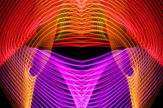 Abstract light pink and oranfe trails in random motion background image Striped Neon Lights in Rainbow Colors xA