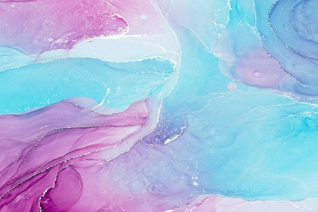 Abstract liquid ink painting background in pink blue colors