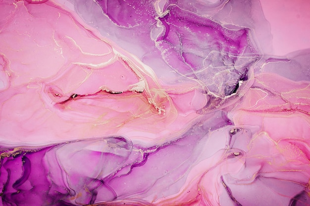 Abstract liquid ink painting background in pink colors