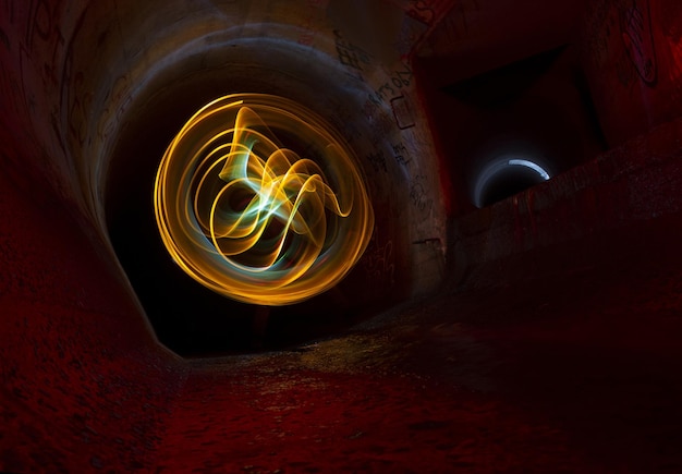 Abstract luminous light painting in the tunnel